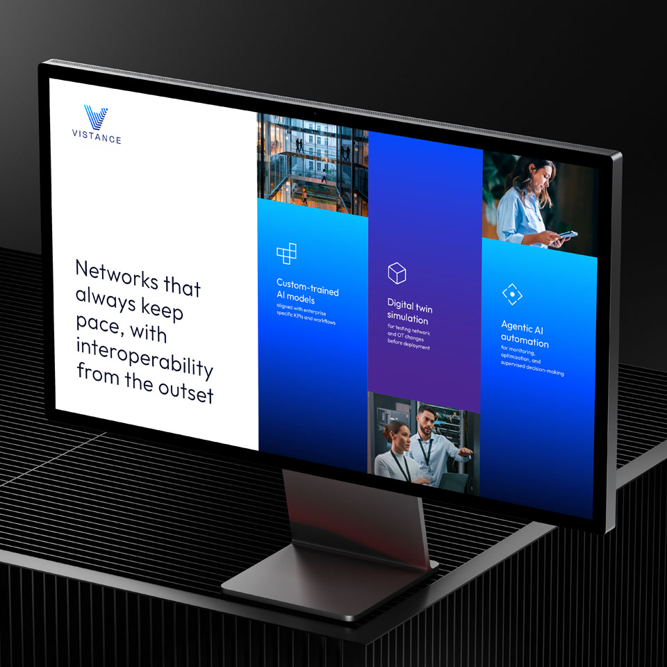 A computer monitor displays a Vistange company slide with information on AI models, digital twin simulation, and agentic AI automation, alongside photos and a slogan about network interoperability.