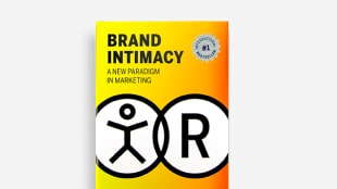 Book titled “Brand Intimacy: A New Paradigm in Marketing” with a bold yellow and orange cover and black graphic symbols.